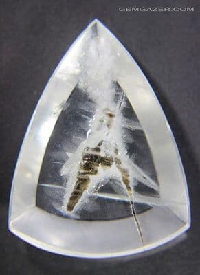 Quartz cabochon with Biotite & Fuchsite Mica inclusions Brazil. 55.54 carats.