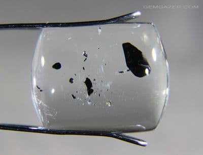 Quartz cabochon with Biotite mica inclusions, China. 15.77 carats.