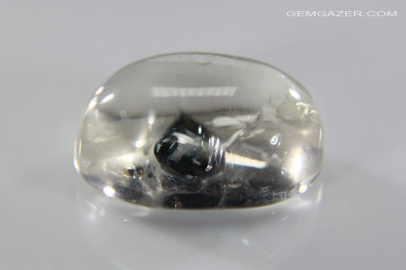 Quartz cabochon with black Anatase crystal inclusion,