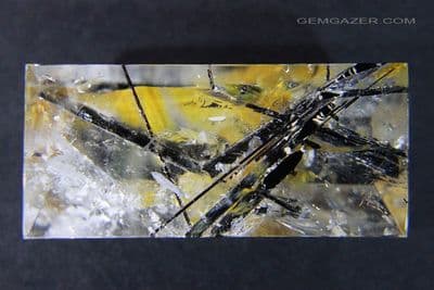 Quartz cabochon with black Tourmaline & Oxide inclusions, Brazil.  68.09 carats.