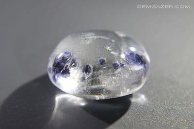 Quartz cabochon with blue Fluorite crystal inclusions, Madagascar. 13.25 carats.