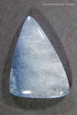 Quartz cabochon with blue Tourmaline inclusions, Brazil.  11.33 carats.