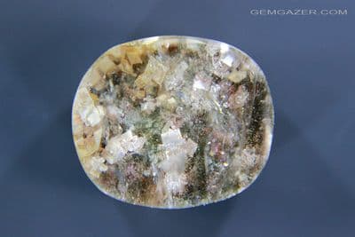Quartz cabochon with Calcite crystal inclusions, Brazil. 15.68 carats.
