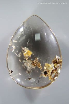 Quartz cabochon with Calcite crystal inclusions, Brazil. 22.69 carats.
