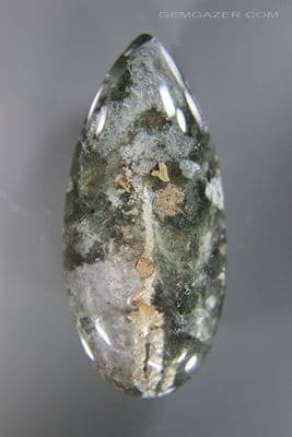 Quartz cabochon with Calcite crystal & Lodolite inclusions, Brazil. 107.81 carats. (Video)