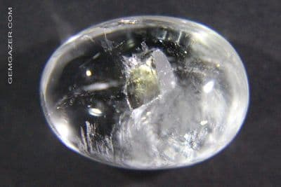 Quartz cabochon with Calcite cube inclusion. Brazil.  12.12 carats.
