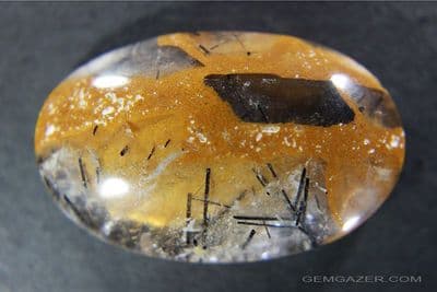 Quartz cabochon with Chalcedony & Tourmaline, Brazil.  52.17 carats.