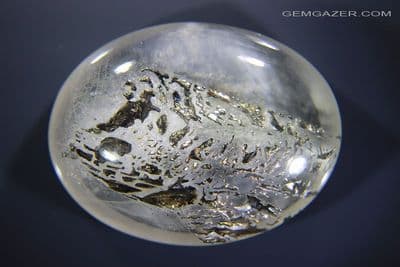 Quartz cabochon with Chalcopyrite inclusions, Brazil. 117.64 carats. (Video)