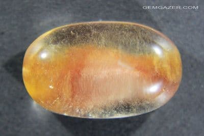 Quartz cabochon with chatoyant Hematite inclusions, aka 