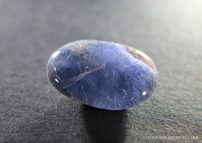 Quartz cabochon with Dumortierite inclusions, Brazil.  14.13 carats.