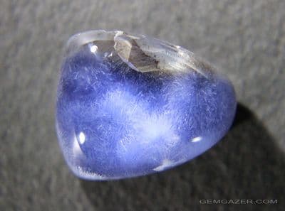 Quartz cabochon with Dumortierite inclusions, Brazil.  15.00 carats. (Video)
