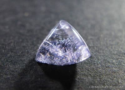 Quartz cabochon with Dumortierite inclusions, Brazil.  3.26 carats. (Video)
