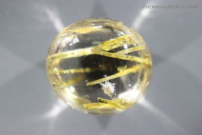 Quartz cabochon with Epidote crystal inclusions, Brazil. 21.10 carats.