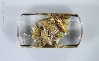 Quartz cabochon with floral Calcite crystal inclusions. Madagascar. 28.89 carats. (Video)