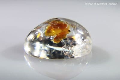 Quartz  cabochon with fluorescent Petroleum (moving bubble), Pakistan. 4.78 carats. (Video)