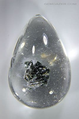 Quartz cabochon with Fuchsite Mica crystal inclusion, China. 50.09 carats.