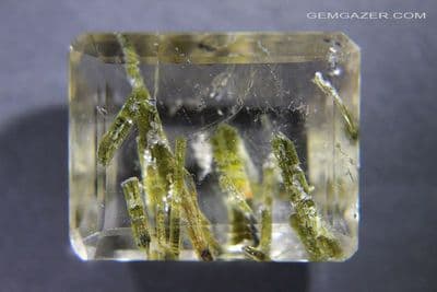 Quartz cabochon with green Epidote inclusions, faceted, Brazil. 52.03 carats.