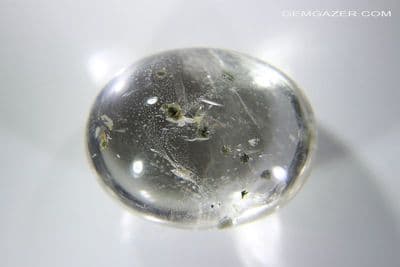 Quartz cabochon with green Fuchsite Mica platelet inclusions, Brazil. 48.76 carats.