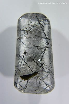 Quartz cabochon with green Verdelite Tourmaline inclusions, Brazil. 31.10 carats.