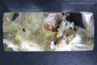 Quartz cabochon with Hematite and Kaolinite inclusions, Brazil.  178.38 carats.