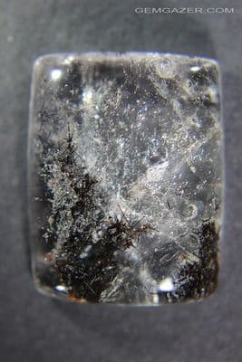 Quartz cabochon with Jamesonite inclusions, Brazil.  46.25 carats.