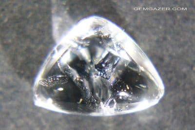 Quartz cabochon with Molybdenite inclusions, Peru.  2.11 carats.