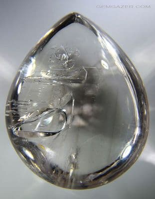 Quartz cabochon with negative crystal inclusions, Madagascar. 282.48 carats.