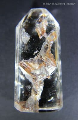 Quartz cabochon with oxide-coated negative crystal inclusions, Madagascar. 117.39 carats.