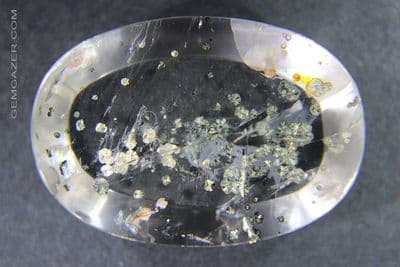 Quartz cabochon with Pyrite inclusions, Brazil.  62.65 carats.