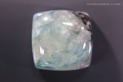 Quartz cabochon with radial Gilalite inclusions, Brazil. 17.64 carats. (Video)