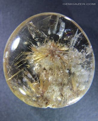Quartz cabochon with Rutile 'flower' inclusion, Brazil.  56.64 carats.