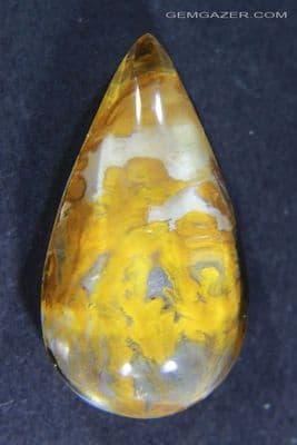 Quartz cabochon with yellow oxides, Brazil. 7.36 carats.