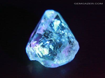 Quartz crystal with fluorescent Petroleum inclusions, Pakistan. 15.03 carats.