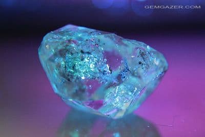 Quartz crystal with fluorescent Petroleum inclusions, Pakistan. 21.74 carats.