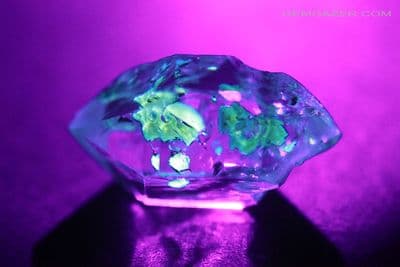Quartz crystal with fluorescent Petroleum inclusions, Pakistan. 9.99 carats.