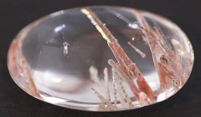 Quartz with Actinolite, cabochon, China.   86.43 carats.
