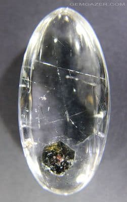 Quartz with Biotite Mica and Tourmaline inclusions, faceted. China. 81.90 carats.