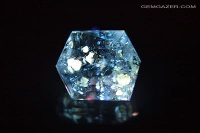 Quartz with fluorescent Petroleum inclusions, faceted, Pakistan. 2.02 carats.