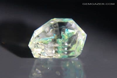 Quartz with fluorescent Petroleum inclusions, faceted, Pakistan. 3.22 carats.