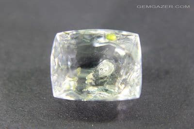 Quartz with fluorescent Petroleum inclusions, faceted, Pakistan. 4.90 carats.