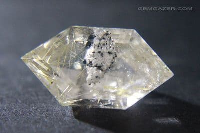 Quartz with Lodolite, Rutile and Hematite inclusions, faceted. Brazil.  13.36 carats.