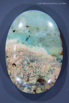 Quartzite cabochon with Chrysocolla, Scapolite, Sphene etc, Peru. 142.20 carats.