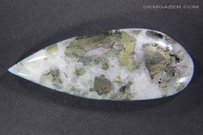 Quartzite cabochon with Norbergite & Pyrite (fluorescent), USA. 41.98 carats.