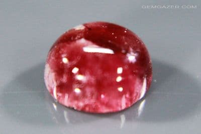 Red Beryl (Bixbite) cabochon, USA.  0.76 carat.