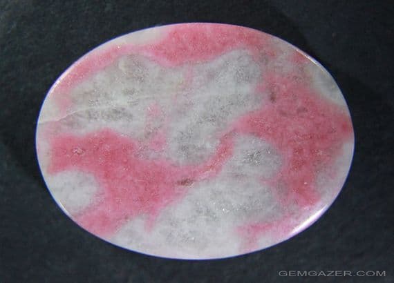 Rhodonite in Quartzite cabochon, China.  67.52 carats.