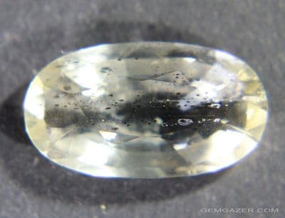 Scapolite with inclusions, yellow faceted, Tanzania.  6.25 carats.