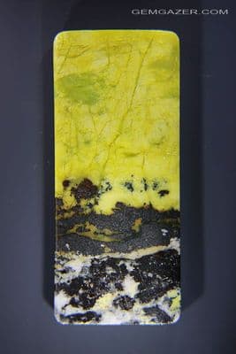 Scenic Yellow Turquoise & Hematite cabochon, Africa. 130.85 carats.