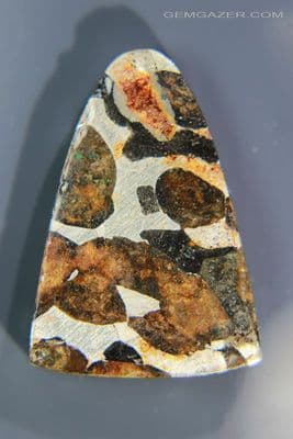 Sericho Pallasite Meteorite cabochon with Olivine crystals, Kenya. 22.88 carats.