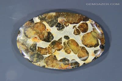 Sericho Pallasite Meteorite cabochon with Olivine crystals, Kenya. 35.45 carats. (Video)