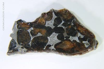 Sericho Pallasite Meteorite slice with Olivine crystals, Kenya. 6.152 grams.